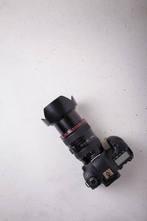 Izmail, Ukraine. April 2022. Canon EOS photo camera with L series zoom lens 24-105 mm on white background, copy spaceのeditorial素材