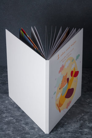 Izmail, Ukraine. October 2020. Baby photo album, photobook with fox on grey background. Inscription: My first year of life, 1 October, some dataのeditorial素材
