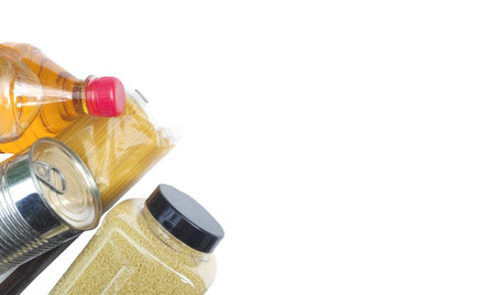 Top view food set, with pasta, canned food, porridge, sunflower oil. Crisis food stocks on a blue background. Safe home food delivery, donation, epidemic, quarantine.の写真素材