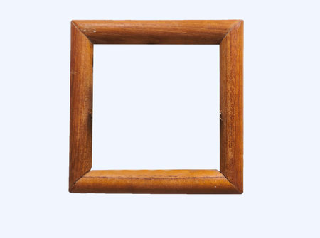 Old wooden square picture frame with empty space in the center isolated on white background
