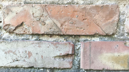 Close up old red brick wall background rough surface exteriot of a buildingの写真素材