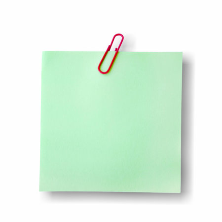 Green note paper with red paper clip, reminder sticker, sticky note isolated on white background