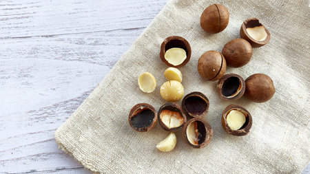 Macadamia nuts with a cutout on a canvas napkin. Healthy organic food.