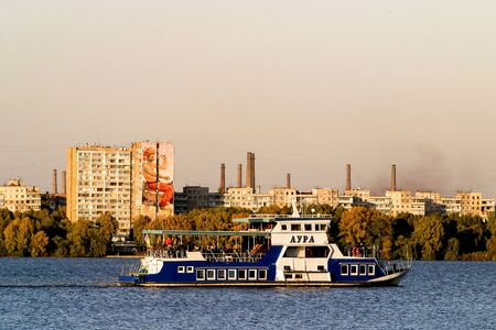 Dnipro river in Dnipro city, Ukraine. Cityscape Housing estate Sunny . Mural artwork is created by Artist Olexander Brytcev. The artwork is symbolises the image of a Kozak. photo is taken on 13.10.19のeditorial素材