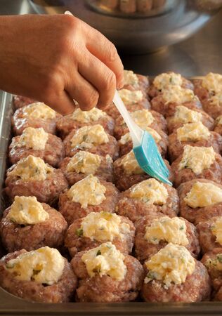 Process of cooking meatballs with cheeseの写真素材