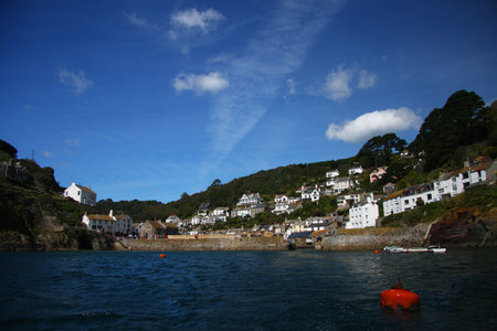 view from the sea on Fishing village of Polperro in Cornwall, England