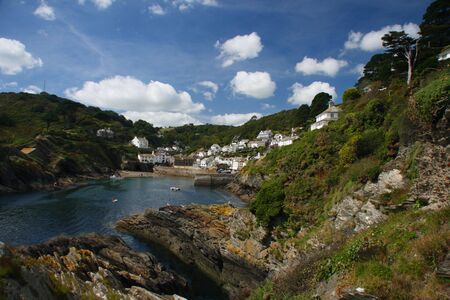 view from the cliffs on harbor and Fishing village of Polperro in Cornwall, Englandの写真素材