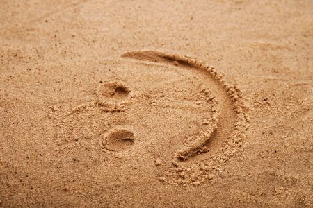 smiley picture on a beach sand, shallow DOFの写真素材