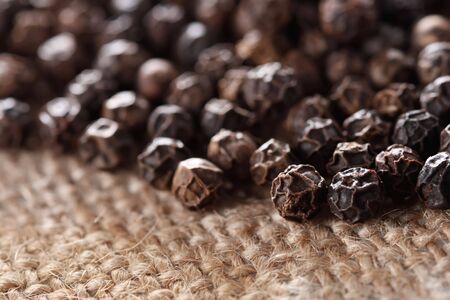 black peppercorns on a hessian background, super macro, shallow DOFの写真素材