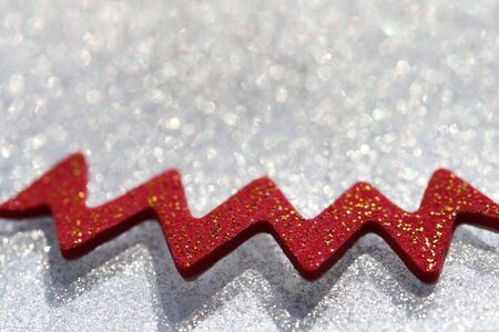 glitter sparkles dust with red decoration on background, super macro, shallow DOFの写真素材
