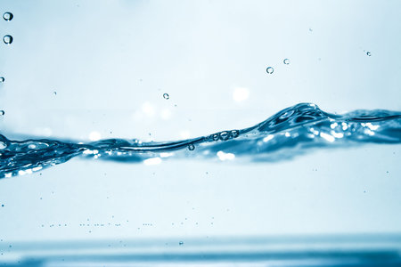 Blue lagoon color water in motion with bubbles, perfect for backgroundの写真素材