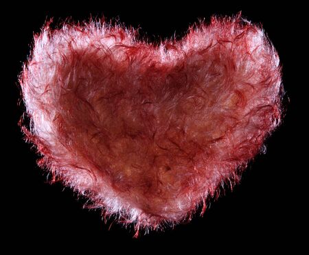 red fluffy fur Heart, over blackの写真素材