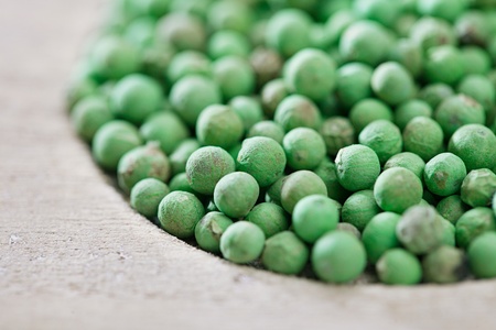 green peppercorn in wooden bowl, shallow dofの写真素材