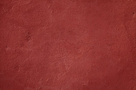 Old plaster wall texture background in Ochre City Marrakech, Morocco