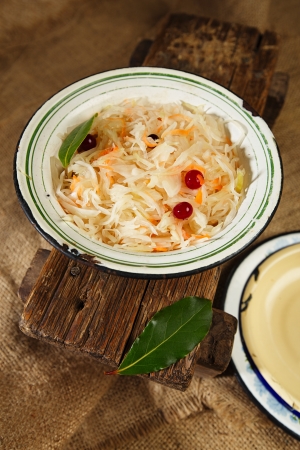 sauerkraut - Sour cabbage -  old enamel bowl with bay leavesの写真素材