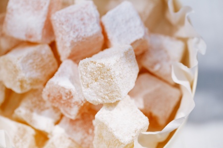 turkish sweet delight, rose and yellow, dusted with caster sugarの写真素材