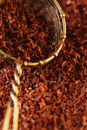 fine grated chocolate 100% dark in sieve , backdrop, backgroundの写真素材