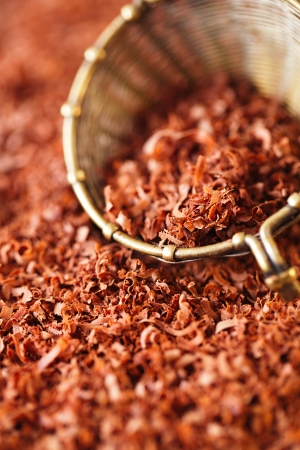 fine grated chocolate 100% dark in sieve , backdrop, backgroundの写真素材