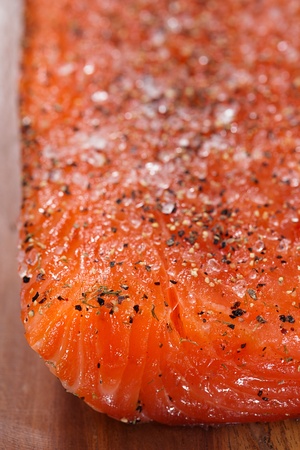 smocked salmon homemade, with spice on wooden board, shallow dofの写真素材