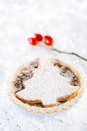 christmas  tart with marzipan tree on white snow festive backgroundの写真素材