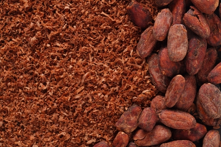 cocoa beans and grated chocolate backgroundの写真素材