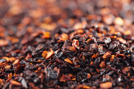 chipotle - jalapeno smoked chili flakes background, shallow dof