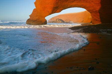 Legzira dramatic natural stone arches reaching over the sea, Atlantic Ocean, Morocco, Africaの写真素材