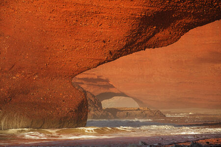 Legzira dramatic natural stone arches reaching over the sea, Atlantic Ocean, Morocco, Africaの写真素材