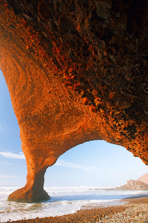 Legzira dramatic natural stone arches reaching over the sea, Atlantic Ocean, Morocco, Africaの写真素材