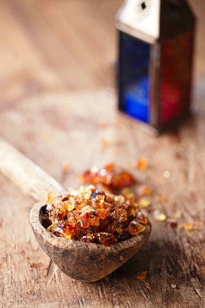 Gum arabic, also known as acacia gum - in old wooden spoonの写真素材