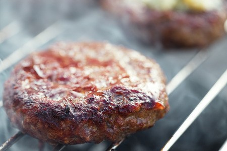 food meat - burgers on bbq barbecue grill Shallow dof.の写真素材