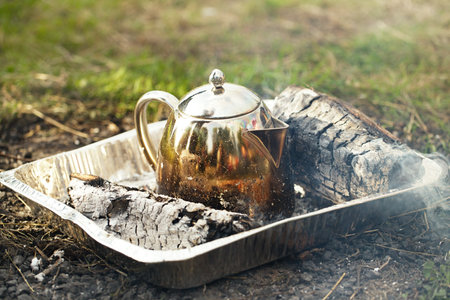 Making tea or coffee in the campfire on natureの写真素材
