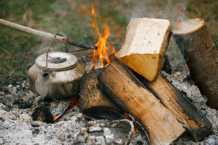 Making tea or coffee in the campfire on natureの写真素材