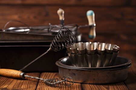 Vintage  Baking Tins and tools on wooden backgroundの写真素材