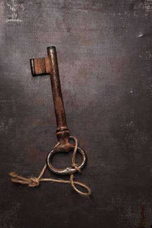iron key on metal backdrop, really vintage and oldの写真素材
