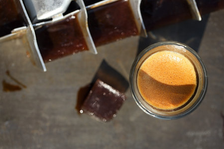 espresso with ice cubes coffee and vintage ice cube trayの写真素材