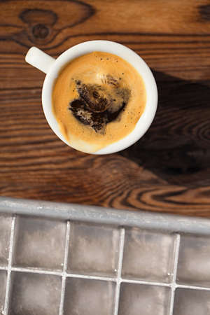 espresso with ice cubes coffee and vintage ice cube trayの写真素材