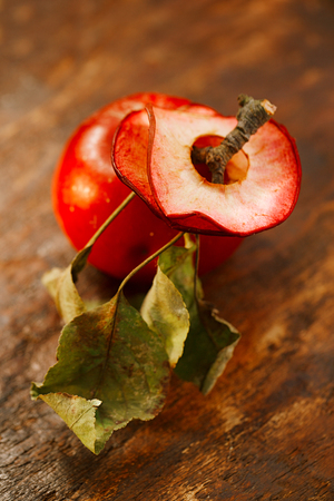 Dried red-fleshed apple vaiety slices with vintage backgroundの写真素材