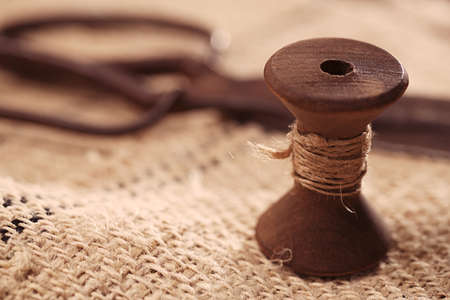 real old reels spools with hemp treads on old grain sacking linen Completely hand made  handwoven and homespunの写真素材