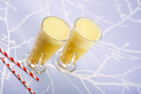 Turmeric latte a golden twist to coffee, The drink is made by steaming milk with aromatic turmeric powder and spicesの写真素材