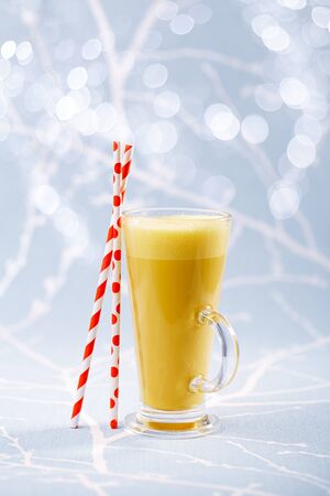 Turmeric latte a golden twist to coffee, The drink is made by steaming milk with aromatic turmeric powder and spicesの写真素材