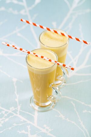 Turmeric latte or golden milk , The drink is made by steaming milk with aromatic turmeric powder and spicesの写真素材