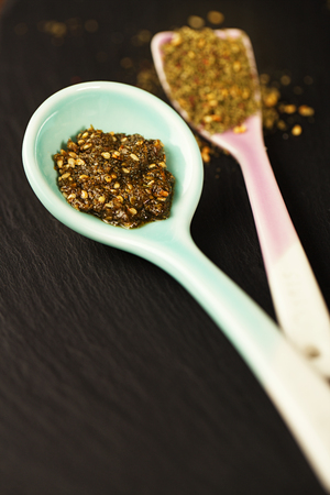 Zaatar spice mix - traditional Middle Eastern blend made with thyme, sesame seeds, salt, sumac, oregano, cumin, fennel seeds and marjoramの写真素材