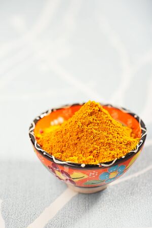 turmeric latte spice mix in small bowlの写真素材