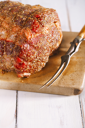 ribeye rib eye ready for roast on wooden boardの写真素材