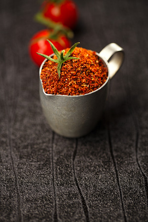 Natural ground sun dried tomato powder have a very particular flavour, both sweet and savouryの写真素材