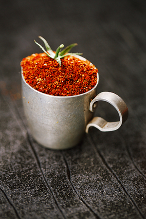 Natural ground sun dried tomatoes powder have a very particular flavour, both sweet and savouryの写真素材