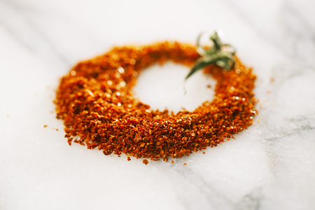 Natural ground sun dried tomatoes powder have a very particular flavour, both sweet and savouryの写真素材