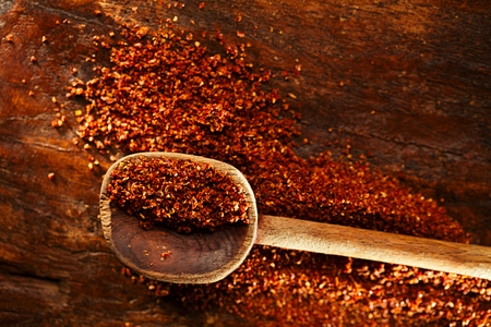 Natural ground sun dried tomatoes powder have a very particular flavour, both sweet and savouryの写真素材