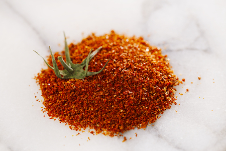 Natural ground sun dried tomatoes powder have a very particular flavour, both sweet and savouryの写真素材